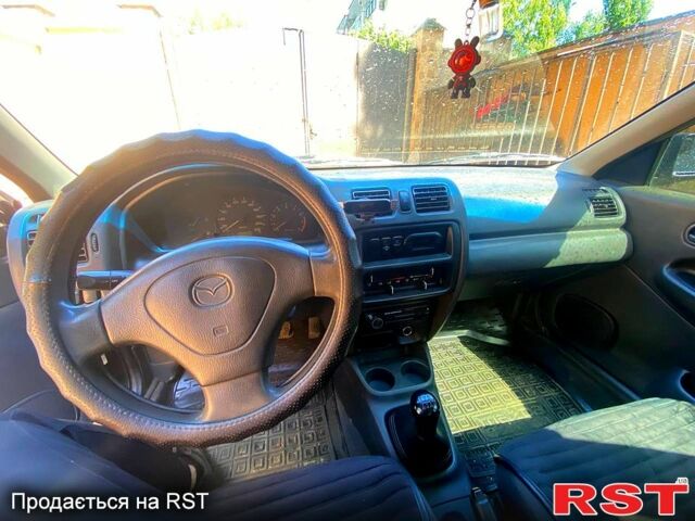 Синий Мазда 323, объемом двигателя 1.5 л и пробегом 396 тыс. км за 2200 $, фото 4 на Automoto.ua