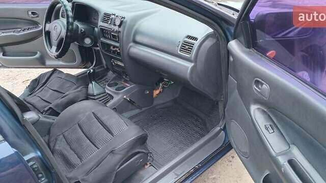 Синій Мазда 323, об'ємом двигуна 1.5 л та пробігом 70 тис. км за 1950 $, фото 10 на Automoto.ua