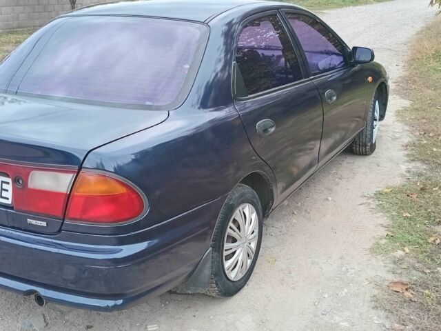 Синий Мазда 323, объемом двигателя 1.5 л и пробегом 74 тыс. км за 1950 $, фото 3 на Automoto.ua