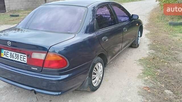 Синій Мазда 323, об'ємом двигуна 1.5 л та пробігом 70 тис. км за 1950 $, фото 3 на Automoto.ua