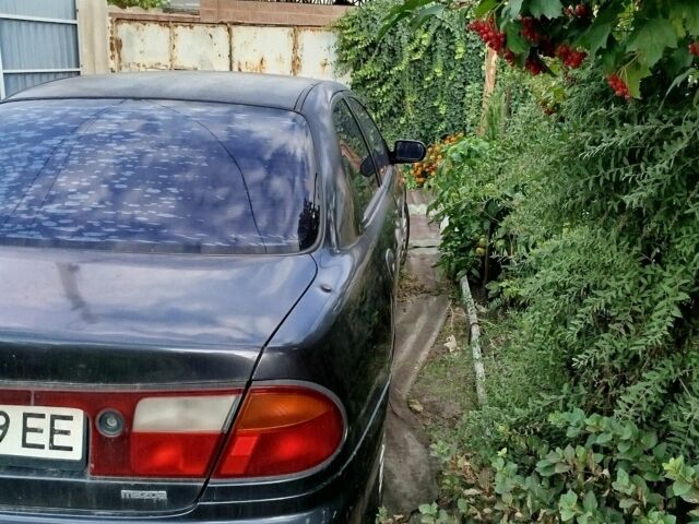 Синий Мазда 323, объемом двигателя 1.5 л и пробегом 400 тыс. км за 2574 $, фото 2 на Automoto.ua