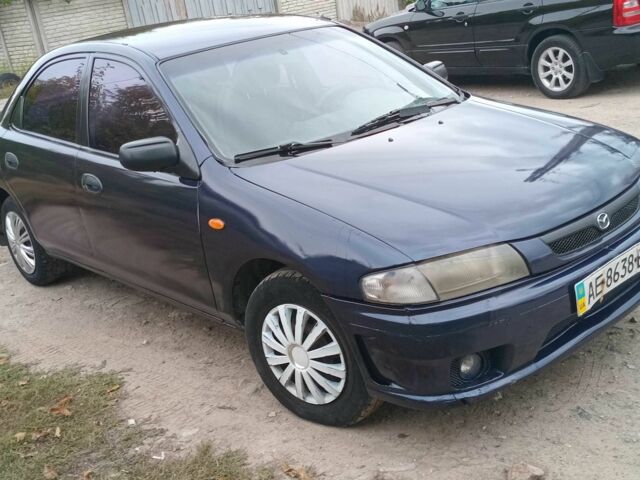 Синий Мазда 323, объемом двигателя 1.5 л и пробегом 74 тыс. км за 1950 $, фото 5 на Automoto.ua