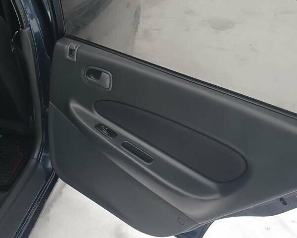 Синий Мазда 323, объемом двигателя 1.84 л и пробегом 299 тыс. км за 2000 $, фото 7 на Automoto.ua