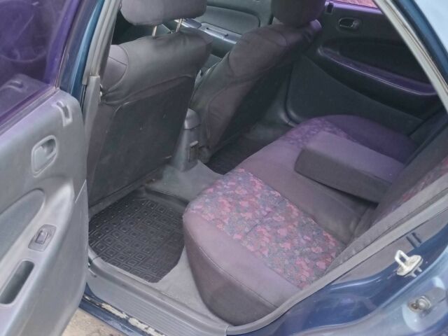 Синий Мазда 323, объемом двигателя 1.5 л и пробегом 74 тыс. км за 1950 $, фото 8 на Automoto.ua