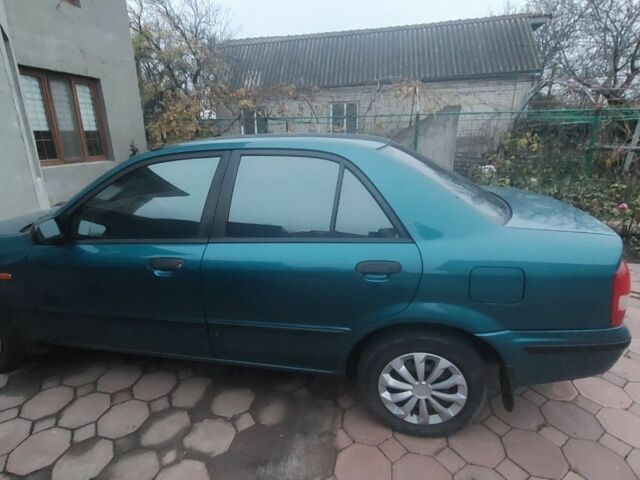 Синий Мазда 323, объемом двигателя 1.5 л и пробегом 280 тыс. км за 2700 $, фото 1 на Automoto.ua