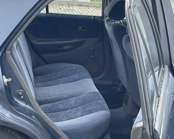 Синий Мазда 323, объемом двигателя 2 л и пробегом 310 тыс. км за 2000 $, фото 7 на Automoto.ua