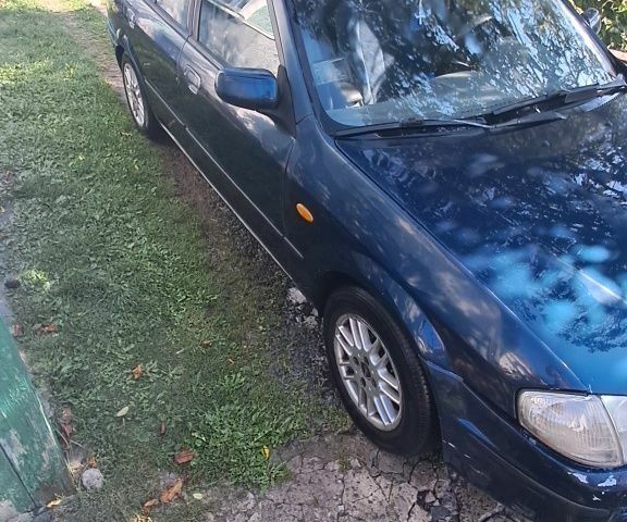 Синий Мазда 323, объемом двигателя 2 л и пробегом 310 тыс. км за 800 $, фото 2 на Automoto.ua