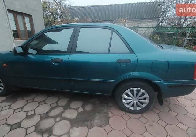 Синий Мазда 323, объемом двигателя 1.5 л и пробегом 280 тыс. км за 2700 $, фото 2 на Automoto.ua