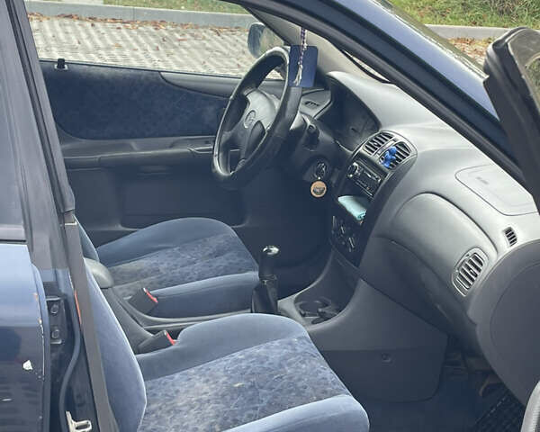 Синий Мазда 323, объемом двигателя 2 л и пробегом 310 тыс. км за 2500 $, фото 6 на Automoto.ua