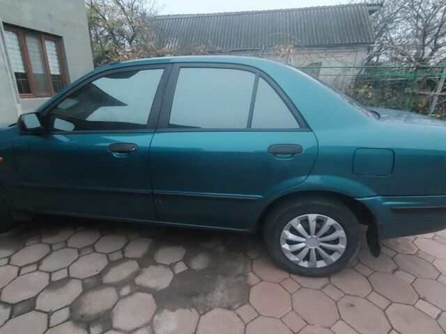 Синий Мазда 323, объемом двигателя 1.5 л и пробегом 280 тыс. км за 2700 $, фото 2 на Automoto.ua