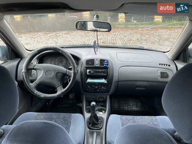 Синий Мазда 323, объемом двигателя 2 л и пробегом 310 тыс. км за 2500 $, фото 5 на Automoto.ua