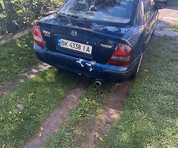 Синий Мазда 323, объемом двигателя 2 л и пробегом 310 тыс. км за 800 $, фото 3 на Automoto.ua