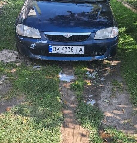 Синий Мазда 323, объемом двигателя 2 л и пробегом 310 тыс. км за 800 $, фото 5 на Automoto.ua