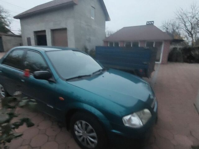 Синий Мазда 323, объемом двигателя 1.5 л и пробегом 280 тыс. км за 2700 $, фото 4 на Automoto.ua