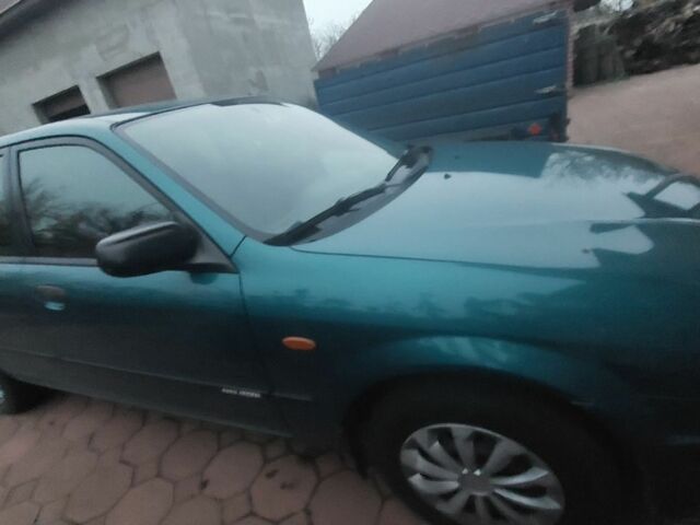 Синий Мазда 323, объемом двигателя 1.5 л и пробегом 280 тыс. км за 2700 $, фото 5 на Automoto.ua