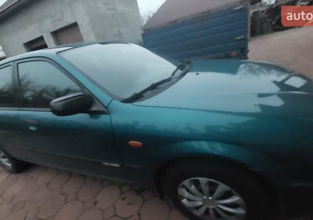 Синий Мазда 323, объемом двигателя 1.5 л и пробегом 280 тыс. км за 2700 $, фото 4 на Automoto.ua
