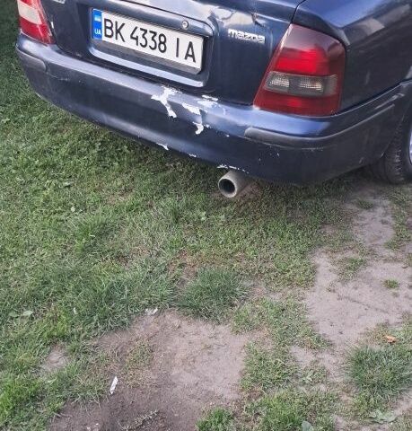 Синий Мазда 323, объемом двигателя 2 л и пробегом 310 тыс. км за 800 $, фото 11 на Automoto.ua