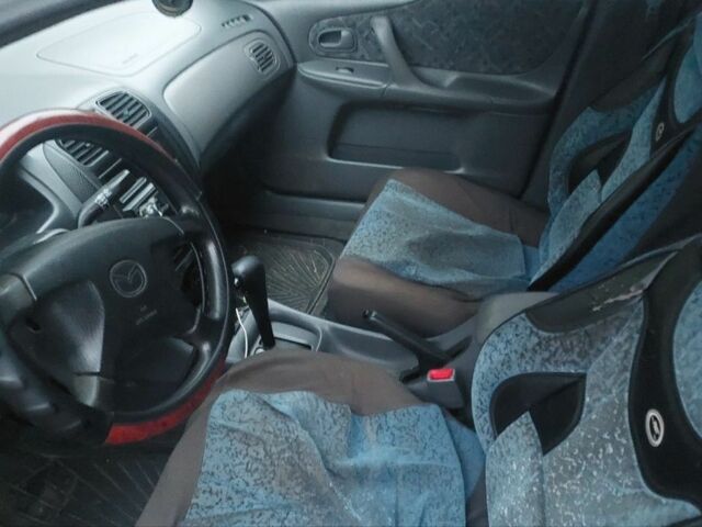 Синий Мазда 323, объемом двигателя 1.5 л и пробегом 280 тыс. км за 2700 $, фото 7 на Automoto.ua