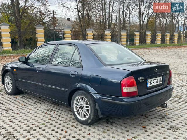 Синий Мазда 323, объемом двигателя 2 л и пробегом 310 тыс. км за 2000 $, фото 3 на Automoto.ua