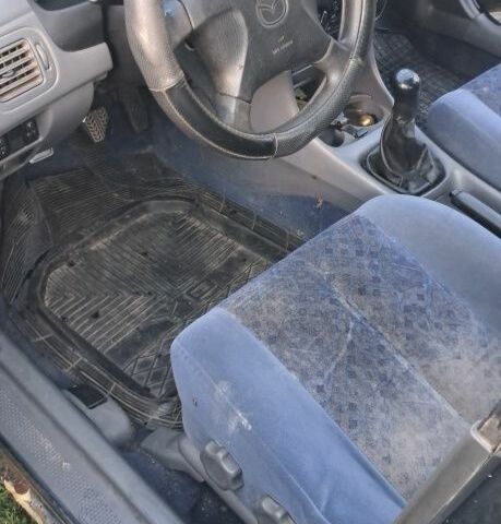 Синий Мазда 323, объемом двигателя 2 л и пробегом 310 тыс. км за 800 $, фото 6 на Automoto.ua