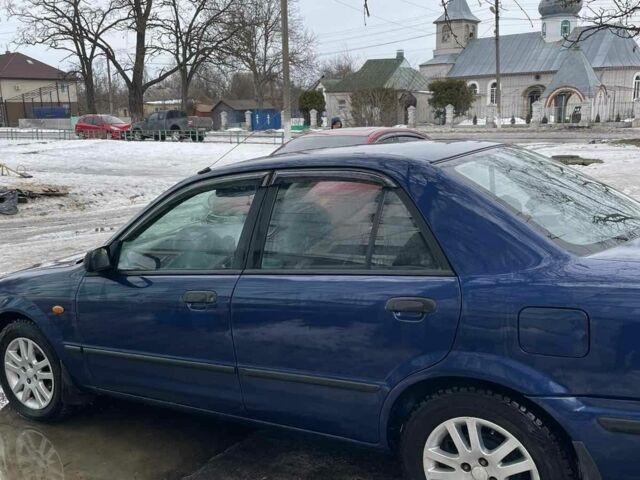 Синій Мазда 323, об'ємом двигуна 2 л та пробігом 390 тис. км за 3500 $, фото 3 на Automoto.ua