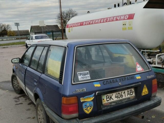 Синий Мазда 323, объемом двигателя 1.5 л и пробегом 100 тыс. км за 715 $, фото 2 на Automoto.ua