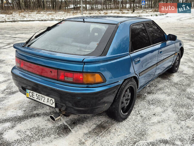 Синий Мазда 323, объемом двигателя 1.6 л и пробегом 195 тыс. км за 999 $, фото 3 на Automoto.ua