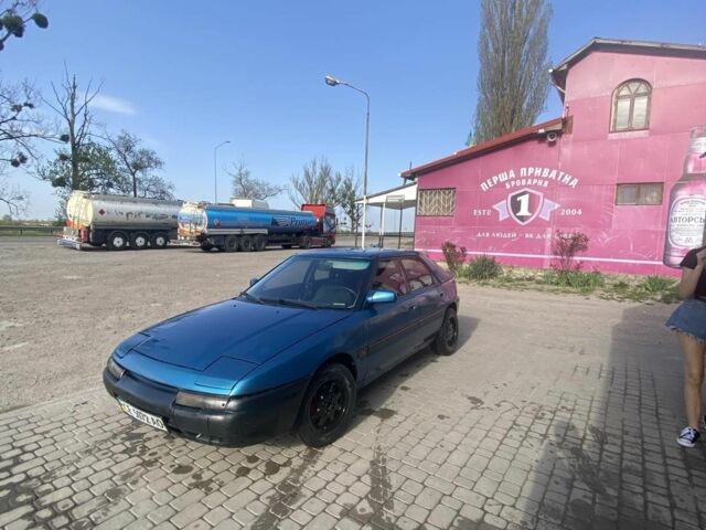 Синий Мазда 323, объемом двигателя 1 л и пробегом 357 тыс. км за 1500 $, фото 1 на Automoto.ua