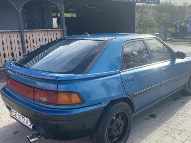 Синий Мазда 323, объемом двигателя 1 л и пробегом 357 тыс. км за 1500 $, фото 4 на Automoto.ua