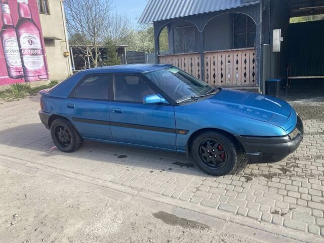 Синий Мазда 323, объемом двигателя 1 л и пробегом 357 тыс. км за 1500 $, фото 2 на Automoto.ua