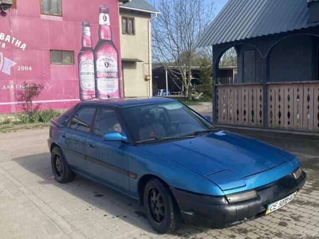 Синий Мазда 323, объемом двигателя 1 л и пробегом 357 тыс. км за 1500 $, фото 3 на Automoto.ua