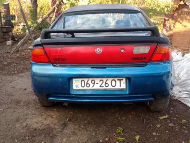 Синий Мазда 323, объемом двигателя 1.8 л и пробегом 345 тыс. км за 700 $, фото 1 на Automoto.ua