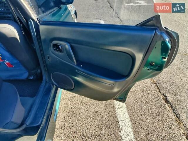 Зеленый Мазда 323, объемом двигателя 1.5 л и пробегом 433 тыс. км за 2700 $, фото 3 на Automoto.ua