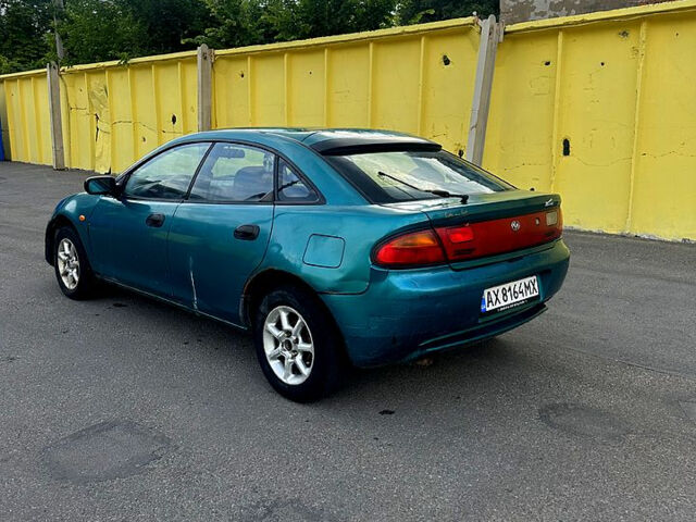 Зеленый Мазда 323, объемом двигателя 1.5 л и пробегом 250 тыс. км за 1350 $, фото 3 на Automoto.ua