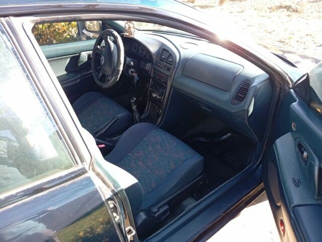 Зеленый Мазда 323, объемом двигателя 1.5 л и пробегом 227 тыс. км за 2500 $, фото 4 на Automoto.ua