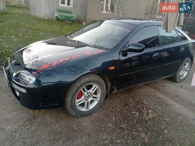 Зелений Мазда 323, об'ємом двигуна 1.49 л та пробігом 280 тис. км за 2500 $, фото 10 на Automoto.ua