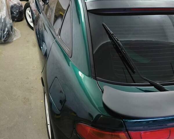 Зеленый Мазда 323, объемом двигателя 1.5 л и пробегом 433 тыс. км за 2700 $, фото 1 на Automoto.ua