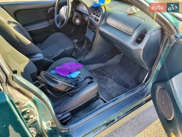 Зеленый Мазда 323, объемом двигателя 1.5 л и пробегом 433 тыс. км за 2700 $, фото 25 на Automoto.ua