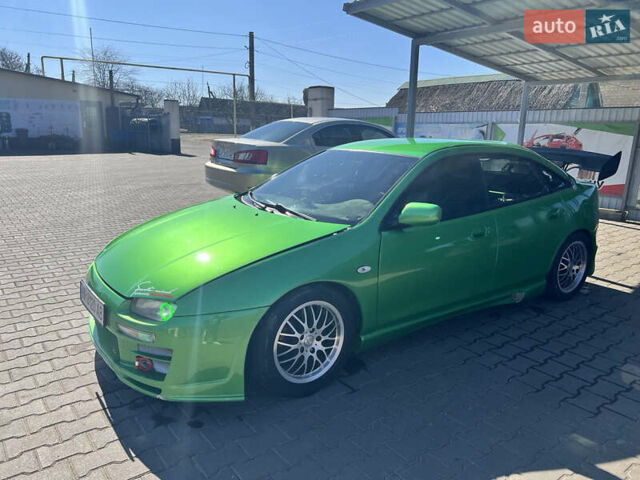 Зеленый Мазда 323, объемом двигателя 2 л и пробегом 200 тыс. км за 4200 $, фото 6 на Automoto.ua