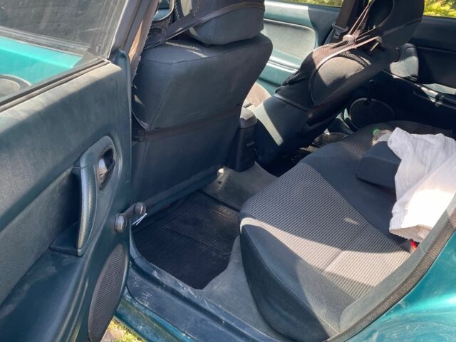 Зелений Мазда 323, об'ємом двигуна 1.5 л та пробігом 370 тис. км за 1900 $, фото 3 на Automoto.ua