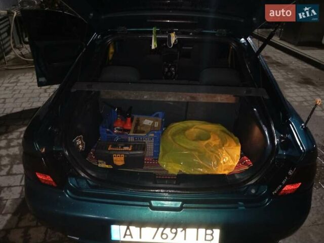 Зеленый Мазда 323, объемом двигателя 1.5 л и пробегом 350 тыс. км за 2750 $, фото 3 на Automoto.ua