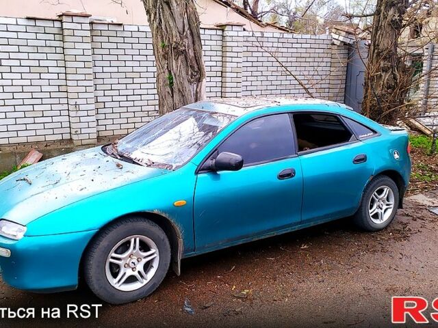 Зеленый Мазда 323, объемом двигателя 1.5 л и пробегом 400 тыс. км за 1500 $, фото 4 на Automoto.ua