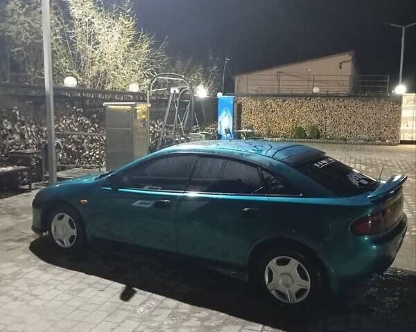 Зеленый Мазда 323, объемом двигателя 1.5 л и пробегом 350 тыс. км за 2750 $, фото 17 на Automoto.ua