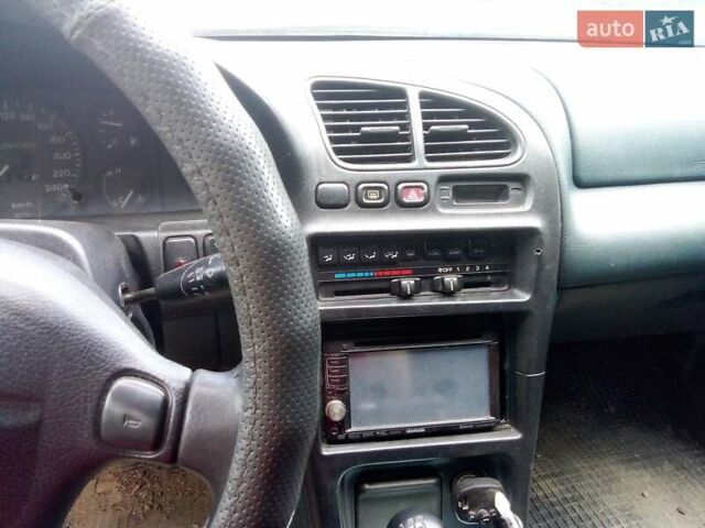 Зеленый Мазда 323, объемом двигателя 1.8 л и пробегом 320 тыс. км за 1700 $, фото 3 на Automoto.ua