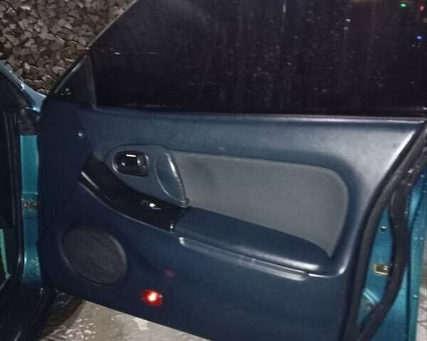 Зеленый Мазда 323, объемом двигателя 1.5 л и пробегом 350 тыс. км за 2750 $, фото 11 на Automoto.ua