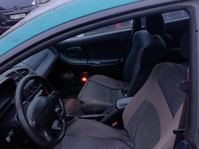 Зеленый Мазда 323, объемом двигателя 1.5 л и пробегом 300 тыс. км за 699 $, фото 4 на Automoto.ua