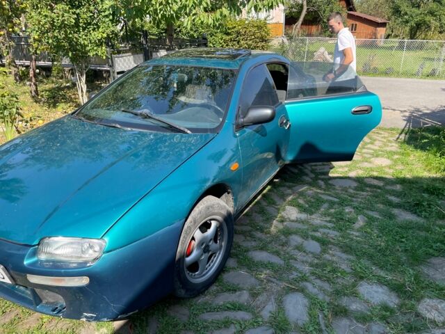 Зелений Мазда 323, об'ємом двигуна 1.5 л та пробігом 370 тис. км за 1900 $, фото 5 на Automoto.ua