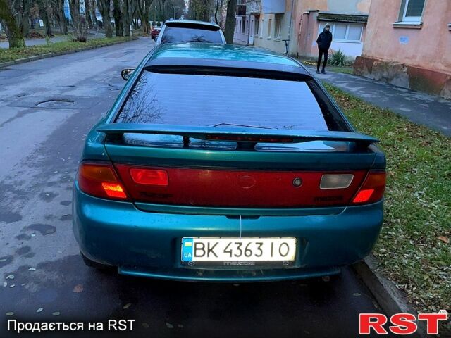 Зеленый Мазда 323, объемом двигателя 1.5 л и пробегом 334 тыс. км за 1800 $, фото 1 на Automoto.ua