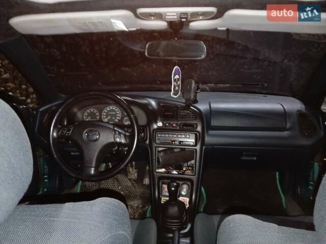 Зеленый Мазда 323, объемом двигателя 1.5 л и пробегом 350 тыс. км за 2750 $, фото 9 на Automoto.ua