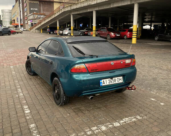 Зеленый Мазда 323, объемом двигателя 1.5 л и пробегом 426 тыс. км за 2300 $, фото 1 на Automoto.ua